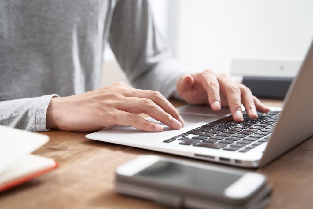 Man typing on computer